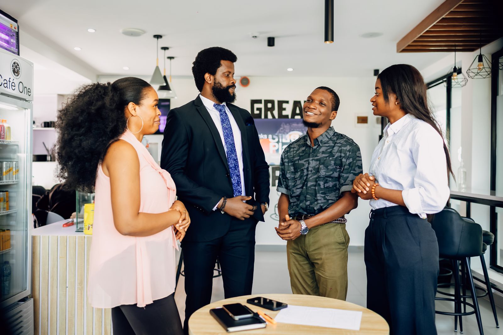 Nigerian business team discussing work in a Lagos office