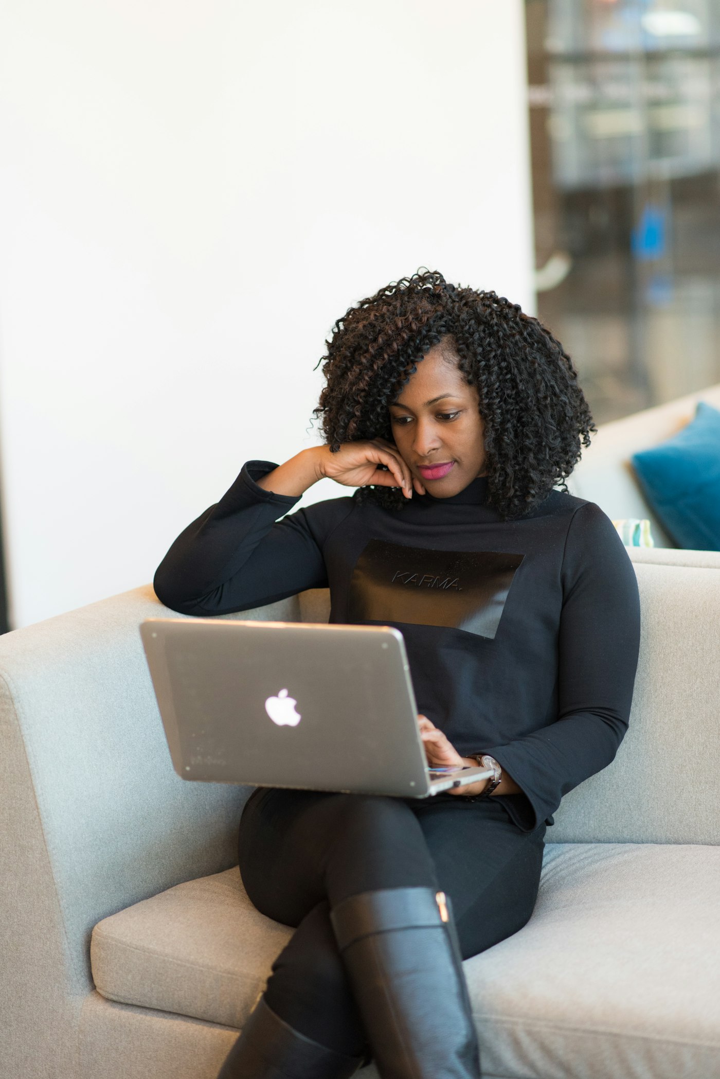 Black self-employed professional managing work from a laptop